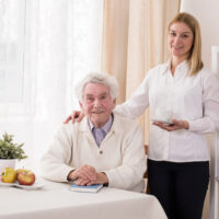 Photo of positive private caregiver and old man Photo of positive private caregiver and old man