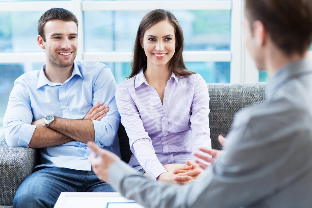 Couple meeting with financial adviser