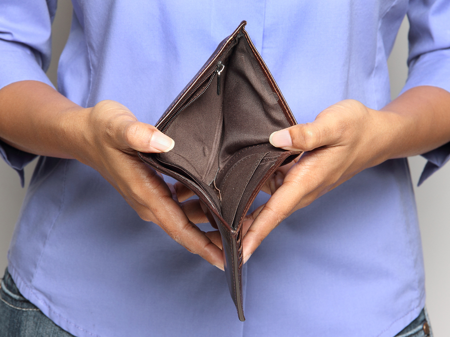 woman holding open empty wallet