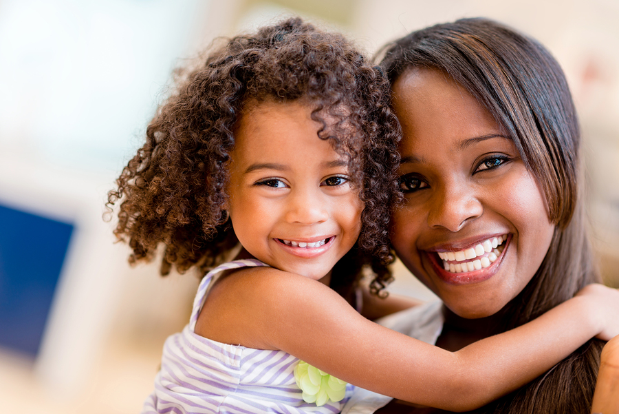 black mom holding happy daughter black mom holding happy daughter